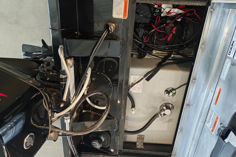 Slide: The Image of 2027 Tracker Pro Team 175 Crappie Edition boat wiring and engine compartment view. - 29