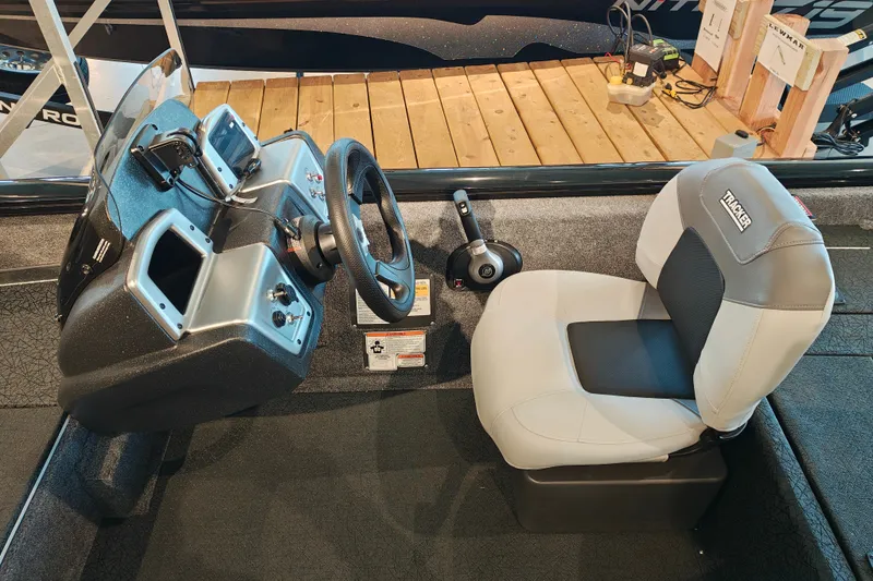 Slide: The Image of 2027 Tracker Pro Team 175 Crappie Edition boat interior with steering console and seat. - 17