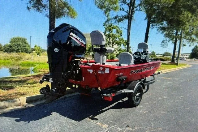 Slide: The Image of 2027 Tracker Pro Team 175 Crappie Edition boat on trailer, parked outdoors. - 13