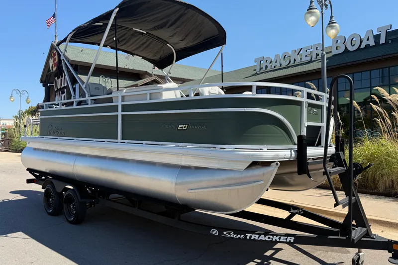 Slide: The Image of 2027 Sun Tracker Fishin' Barge 20 DLX pontoon boat on trailer outside dealership. - 15