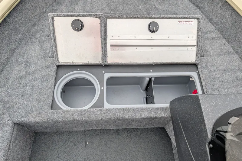Slide: The Image of 2027 Tracker Pro Guide V-16 SC boat storage compartments with pump-out feature. - 54