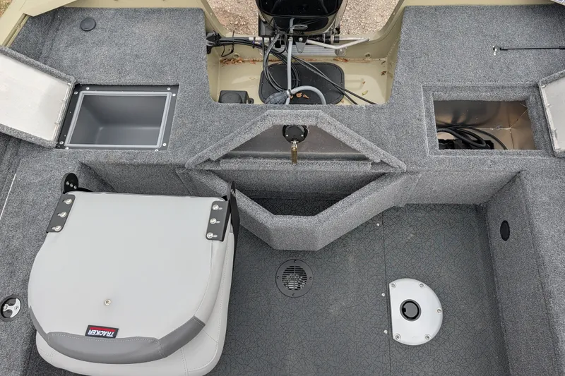 Slide: The Image of Interior of 2027 Tracker Pro Guide V-16 SC boat with storage compartments and seating. - 51