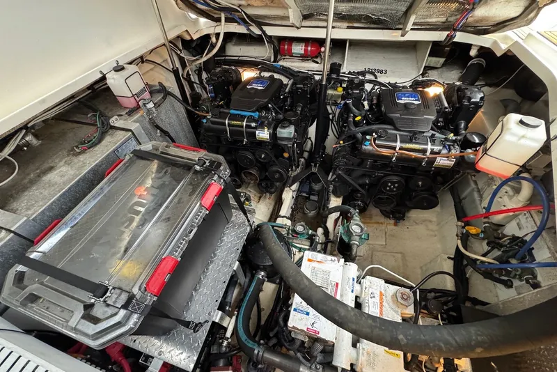 Slide: The Image of Engine compartment of a 2008 Sea Ray Sundancer 310 with dual engines and equipment. - 25
