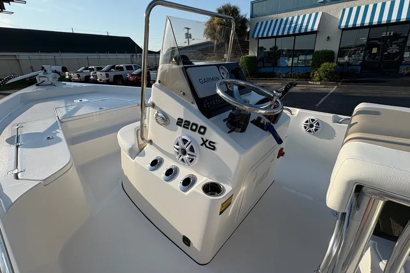 Slide: The Image of 2026 Bulls Bay 2200 XS boat interior with steering console and Garmin navigation system. - 16
