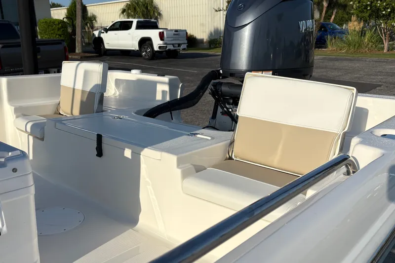 Slide: The Image of 2026 Bulls Bay 2200 XS boat interior with Yamaha engine, featuring beige and white seating. - 7