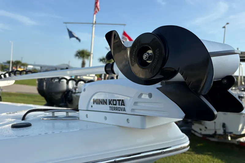 Slide: The Image of Minn Kota Terrova motor on 2026 Bulls Bay 2200 XS boat, flags in background. - 6