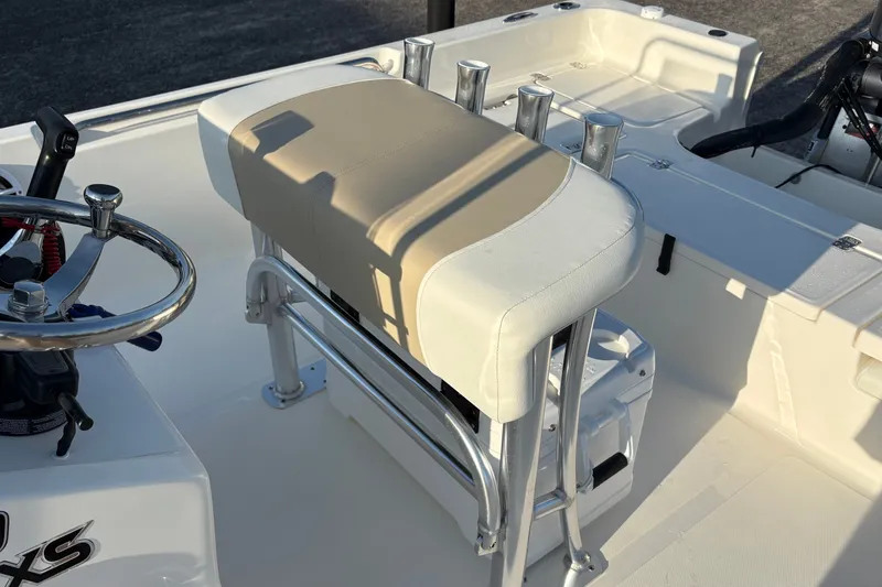 Slide: The Image of 2026 Bulls Bay 2200 XS boat interior with steering wheel and cushioned seat. - 10