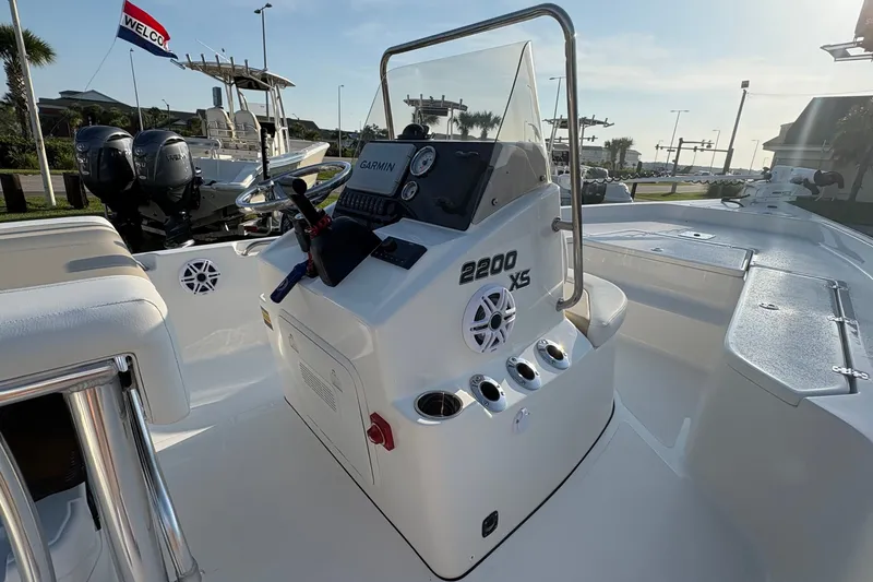 Slide: The Image of 2026 Bulls Bay 2200 XS boat interior with steering console and Garmin navigation system. - 15