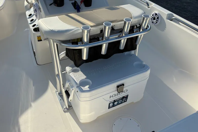 Slide: The Image of 2026 Bulls Bay 2200 XS boat interior with Igloo cooler and rod holders. - 11