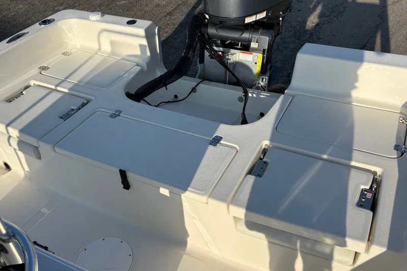 Slide: The Image of 2026 Bulls Bay 2200 XS boat interior with storage compartments and engine view. - 9