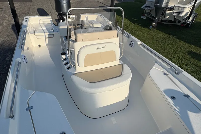 Slide: The Image of 2026 Bulls Bay 2200 XS boat interior with seating and steering console. - 18