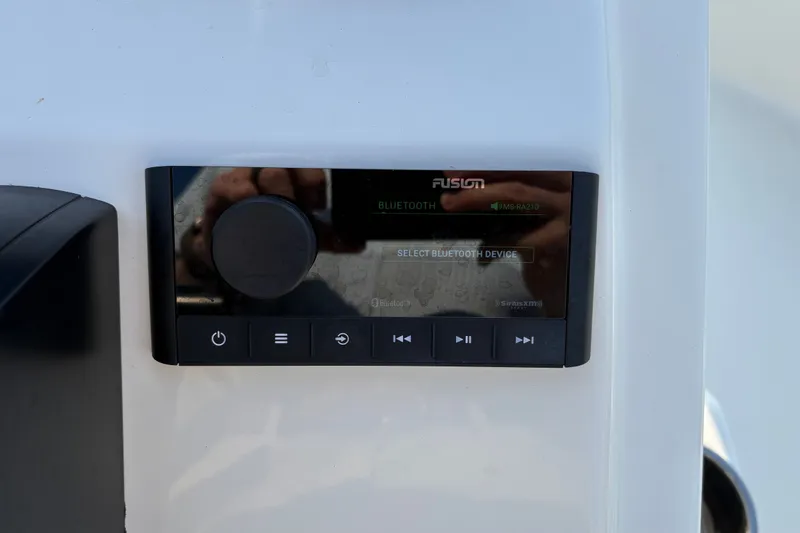 Slide: The Image of Fusion Bluetooth audio system on 2026 Bulls Bay 2200 XS boat dashboard. - 14