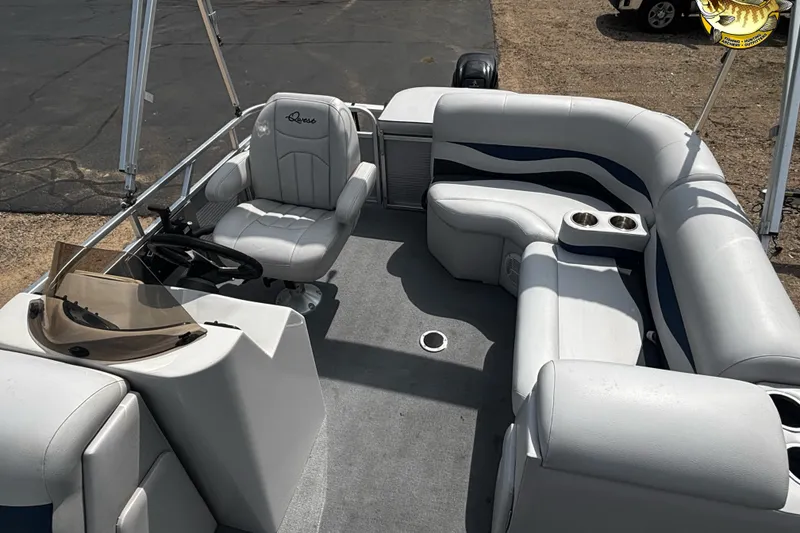 Slide: The Image of 2015 Qwest Adventure 7518 Sport Cruise boat interior with seating and steering console. - 12