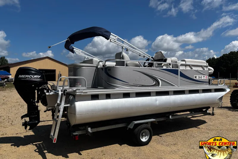 Slide: The Image of 2015 Qwest Adventure 7518 Sport Cruise pontoon boat with Mercury outboard motor on trailer. - 3