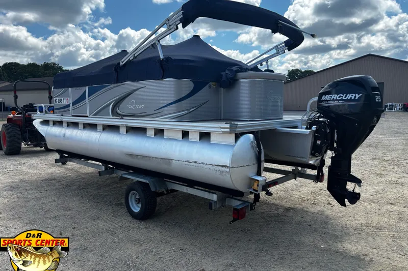 Slide: The Image of 2015 Qwest Adventure 7518 Sport Cruise pontoon boat with Mercury 25 engine on trailer. - 6
