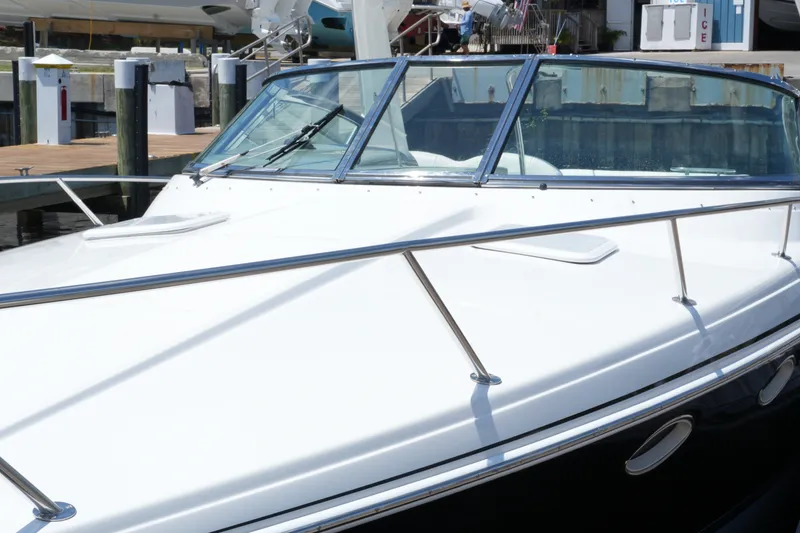 Slide: The Image of 2004 Formula 330 Sun Sport boat docked, showcasing sleek design and polished exterior. - 33