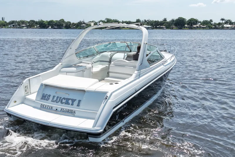 Slide: The Image of 2004 Formula 330 Sun Sport boat cruising on water, labeled "MS Lucky I," Destin, Florida. - 6