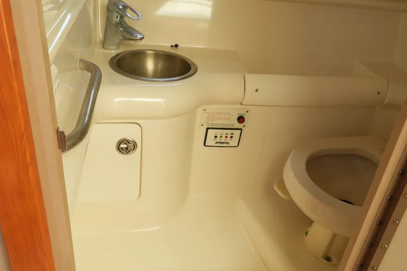 Slide: The Image of 2004 Formula 330 Sun Sport boat bathroom with sink and toilet. - 40