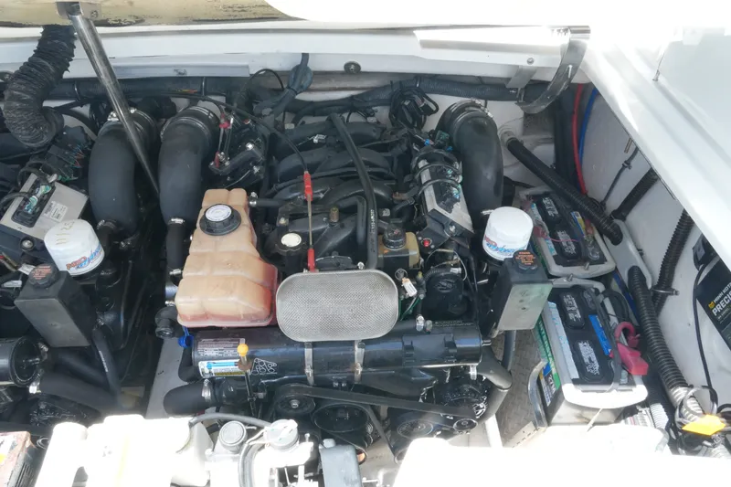 Slide: The Image of Engine compartment of a 2004 Formula 330 Sun Sport boat, showcasing mechanical components. - 42