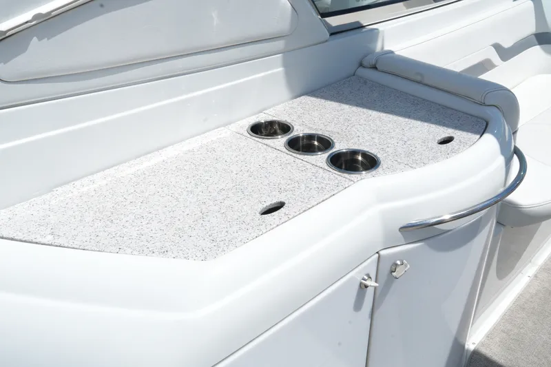 Slide: The Image of 2004 Formula 330 Sun Sport boat interior with cup holders and sleek design. - 20