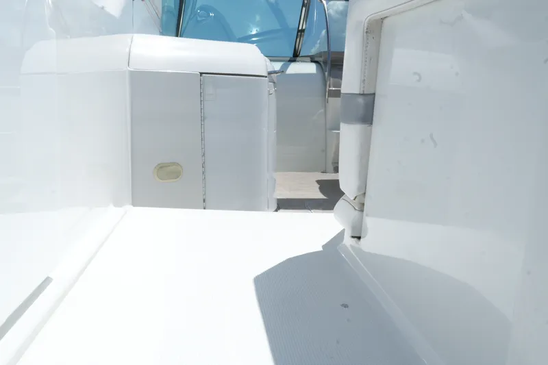 Slide: The Image of 2004 Formula 330 Sun Sport boat interior with white seating and sleek design. - 14