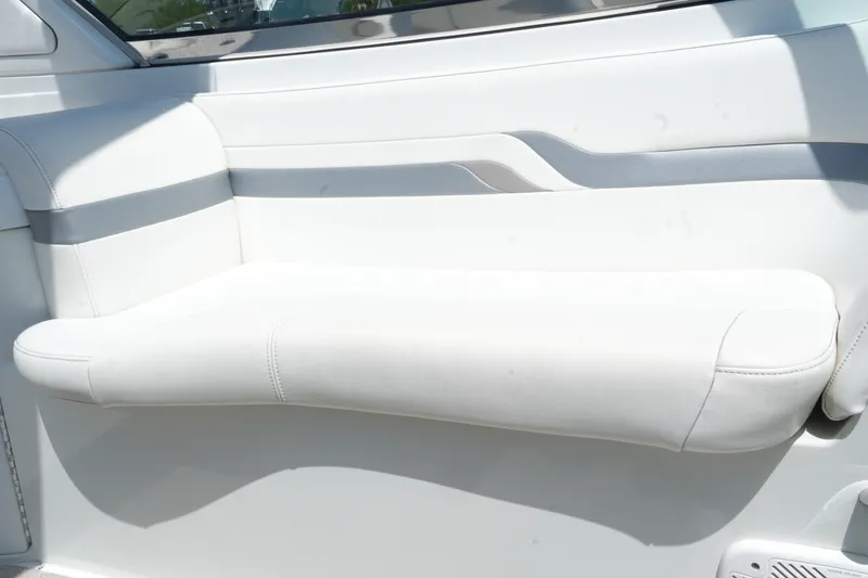 Slide: The Image of White leather seating on a 2004 Formula 330 Sun Sport boat. - 21