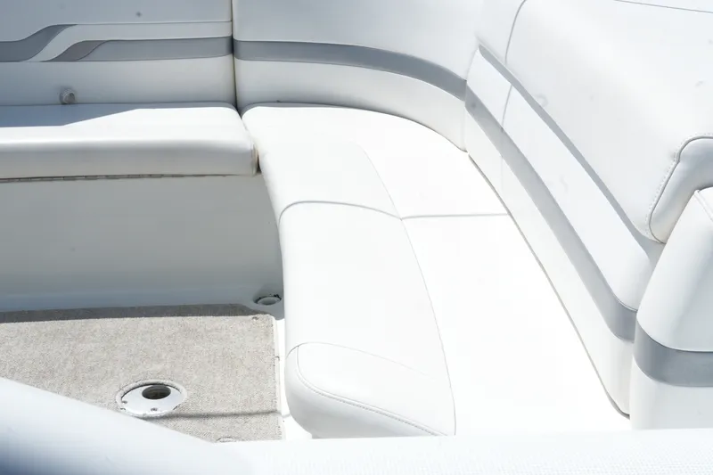 Slide: The Image of 2004 Formula 330 Sun Sport boat interior with white cushioned seating. - 18