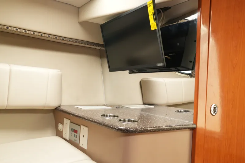 Slide: The Image of Interior of 2004 Formula 330 Sun Sport boat with TV and seating area. - 38