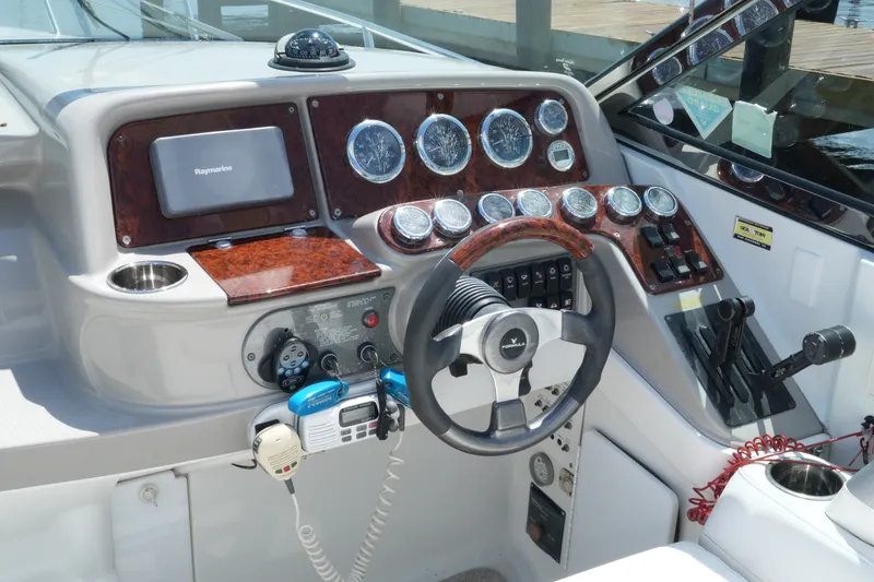 Slide: The Image of Dashboard of a 2004 Formula 330 Sun Sport boat with steering wheel and controls. - 23