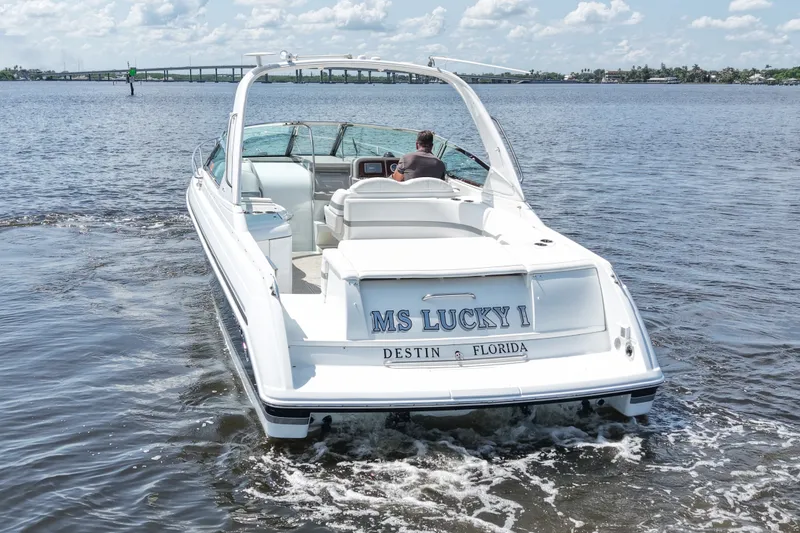 Slide: The Image of 2004 Formula 330 Sun Sport boat cruising on water, labeled "MS Lucky I," Destin, Florida. - 7