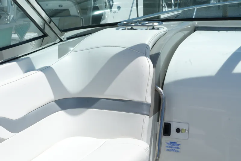 Slide: The Image of 2004 Formula 330 Sun Sport boat interior with white seating and stainless steel accents. - 29