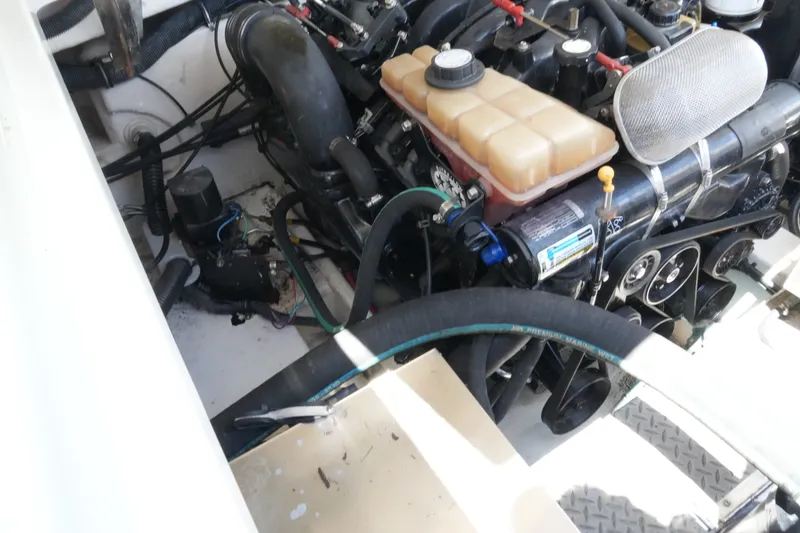 Slide: The Image of Engine compartment of a 2004 Formula 330 Sun Sport boat, showcasing mechanical components. - 43