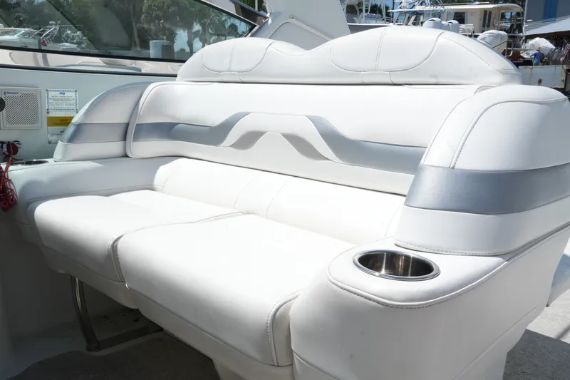 Slide: The Image of Luxurious white seating on a 2004 Formula 330 Sun Sport boat with cup holder. - 22