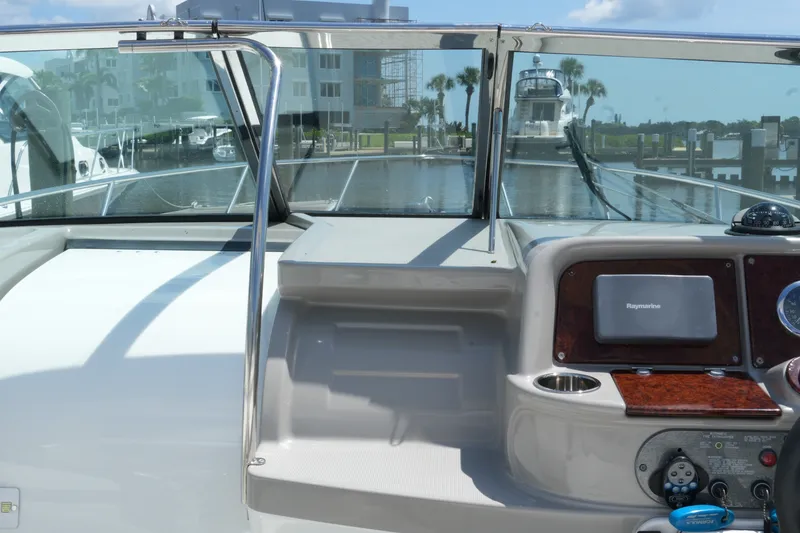 Slide: The Image of 2004 Formula 330 Sun Sport boat dashboard with marina view in the background. - 28
