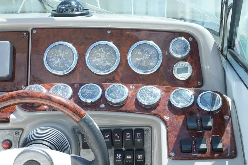 Slide: The Image of Dashboard of a 2004 Formula 330 Sun Sport boat with gauges and controls. - 27