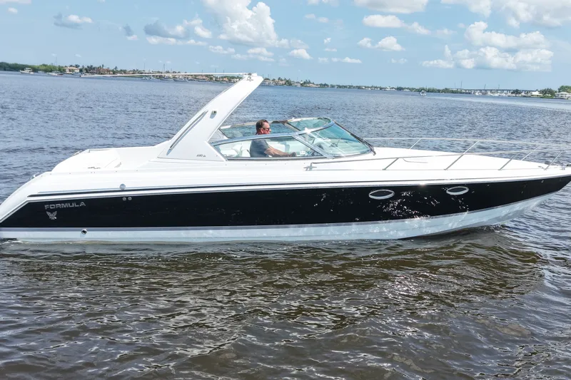 Slide: The Image of 2004 Formula 330 Sun Sport boat cruising on a sunny day. - 5