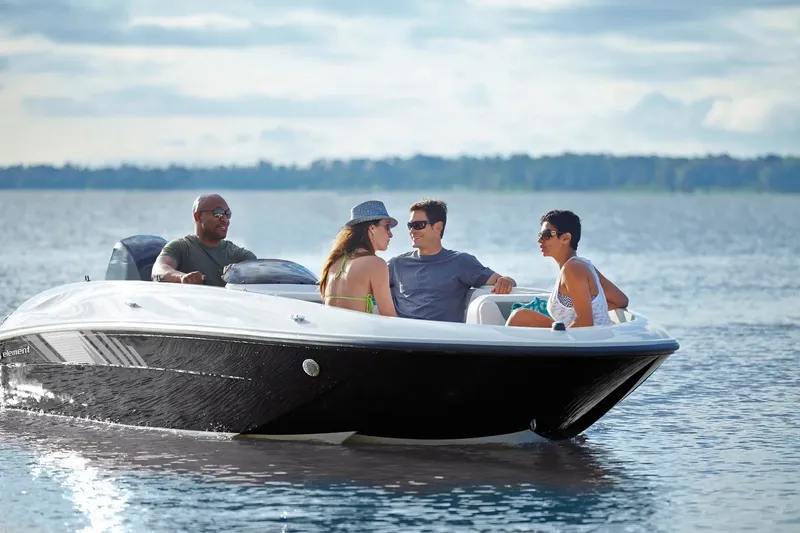 Slide: The Image of 2027 Bayliner Element E18 boat with four people enjoying a sunny day on the water. - 8
