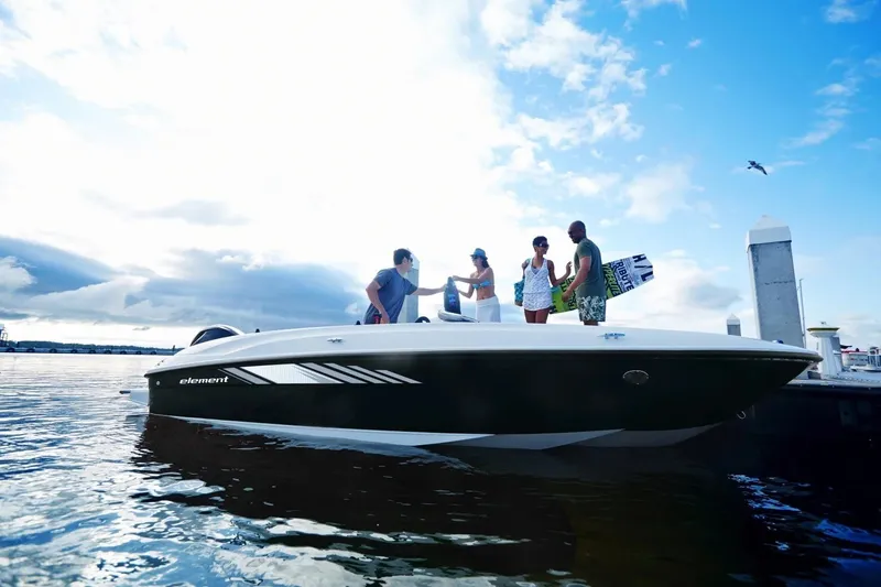 Slide: The Image of 2027 Bayliner Element E18 boat with people enjoying a sunny day on the water. - 5