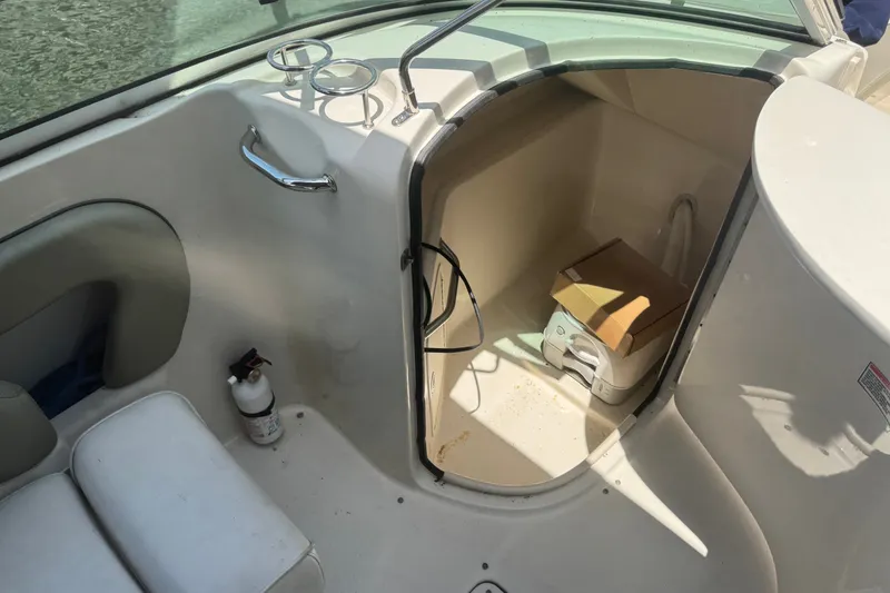 Slide: The Image of Interior of a 2006 Sea Ray 240 Sundeck boat with storage compartment. - 14