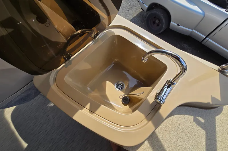 Slide: The Image of Built-in sink with chrome faucet on 2013 Sanpan 2500 FE boat. - 40