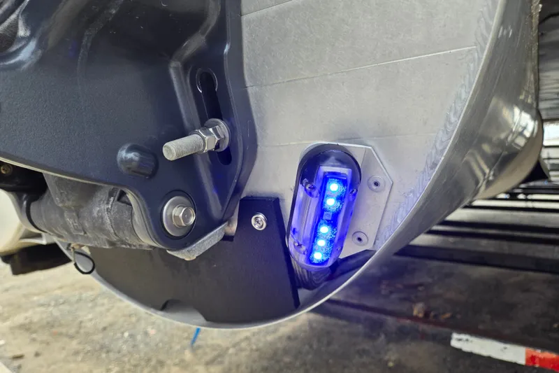 Slide: The Image of Close-up of 2013 Sanpan 2500 FE boat component with blue LED light. - 47