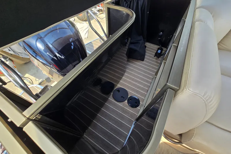 Slide: The Image of Interior view of a 2013 Sanpan 2500 FE boat, showcasing seating and flooring details. - 38