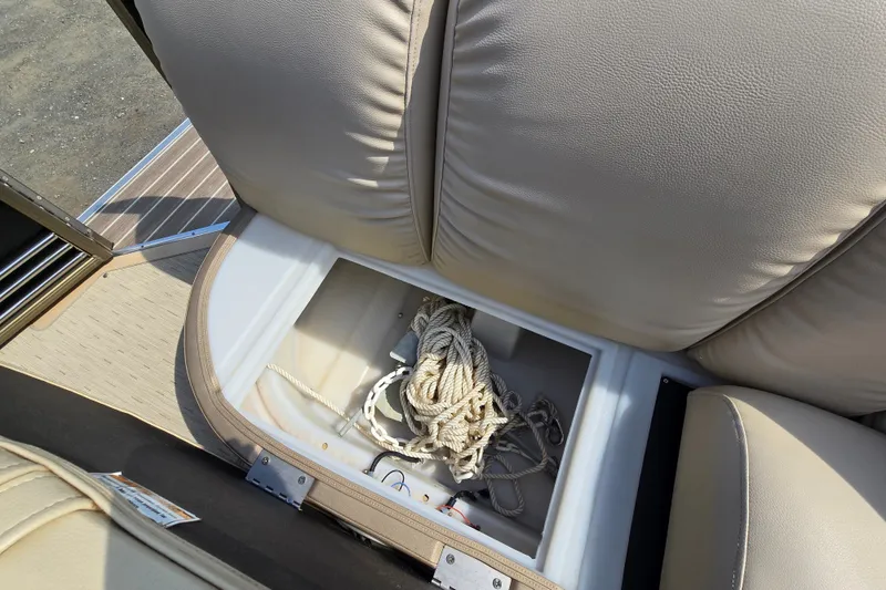 Slide: The Image of Storage compartment with rope in a 2013 Sanpan 2500 FE boat. - 27