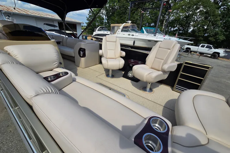 Slide: The Image of Luxurious interior of a 2013 Sanpan 2500 FE pontoon boat with plush seating. - 17