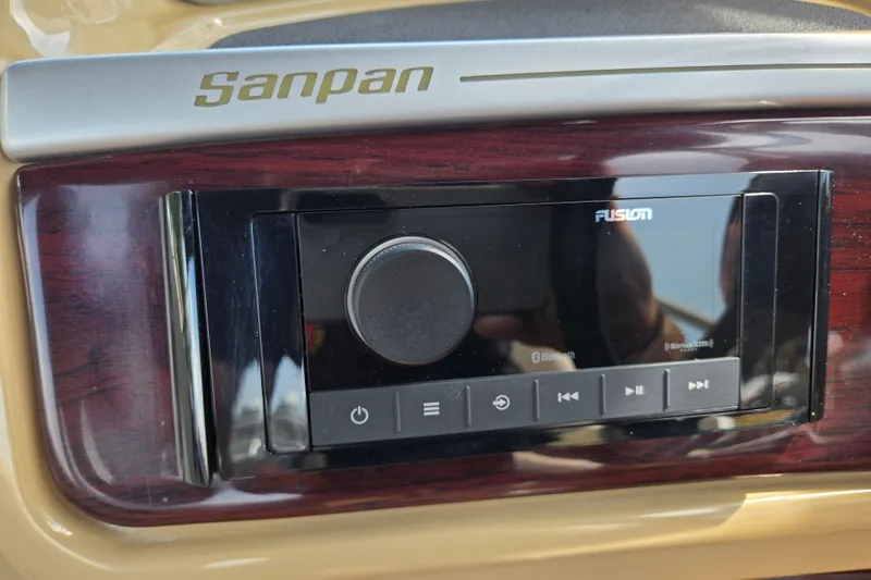 Slide: The Image of Sanpan 2500 FE 2013 dashboard with Fusion audio system and wood paneling. - 35