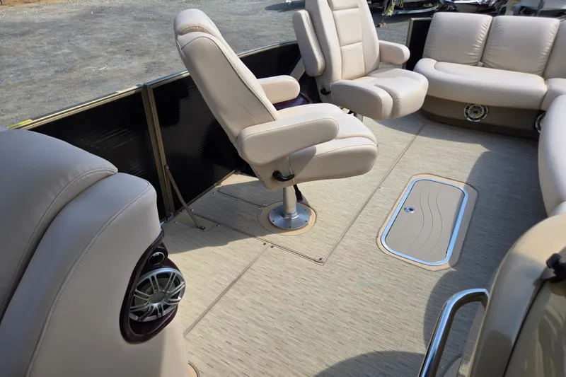 Slide: The Image of Luxurious seating on 2013 Sanpan 2500 FE pontoon boat with beige upholstery. - 15