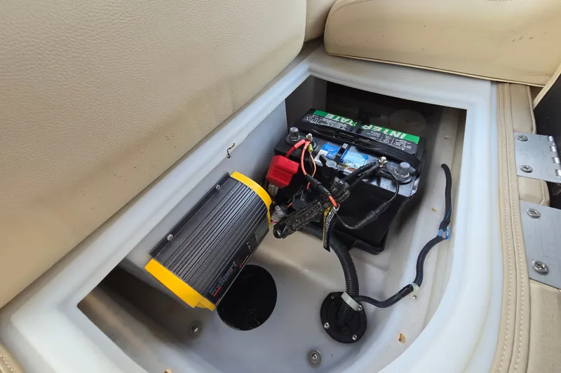 Slide: The Image of Battery compartment of a 2013 Sanpan 2500 FE boat with wiring and inverter. - 43