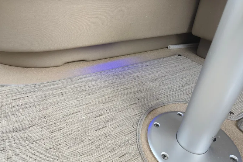 Slide: The Image of Interior of a 2013 Sanpan 2500 FE boat showing flooring and metal pole. - 46