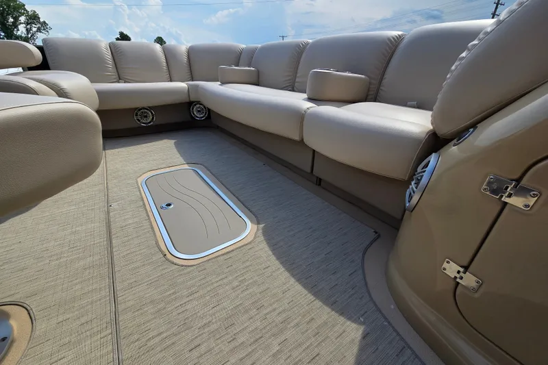 Slide: The Image of Luxurious seating on a 2013 Sanpan 2500 FE pontoon boat with beige upholstery. - 19