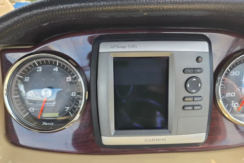 Slide: The Image of Dashboard of 2013 Sanpan 2500 FE with Garmin GPSmap 531s and gauges. - 31